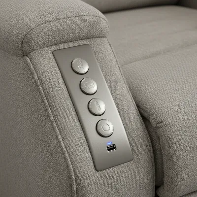 A detailed shot of a Flexsteel recliner's control panel with USB charging port, highlighting modern features.