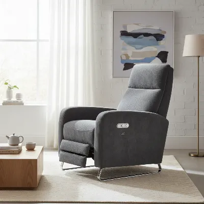 A modern recliner chair with sleek lines, featuring visible power control buttons and a USB port, showcasing comfort and integrated technology in a contemporary living room setting.